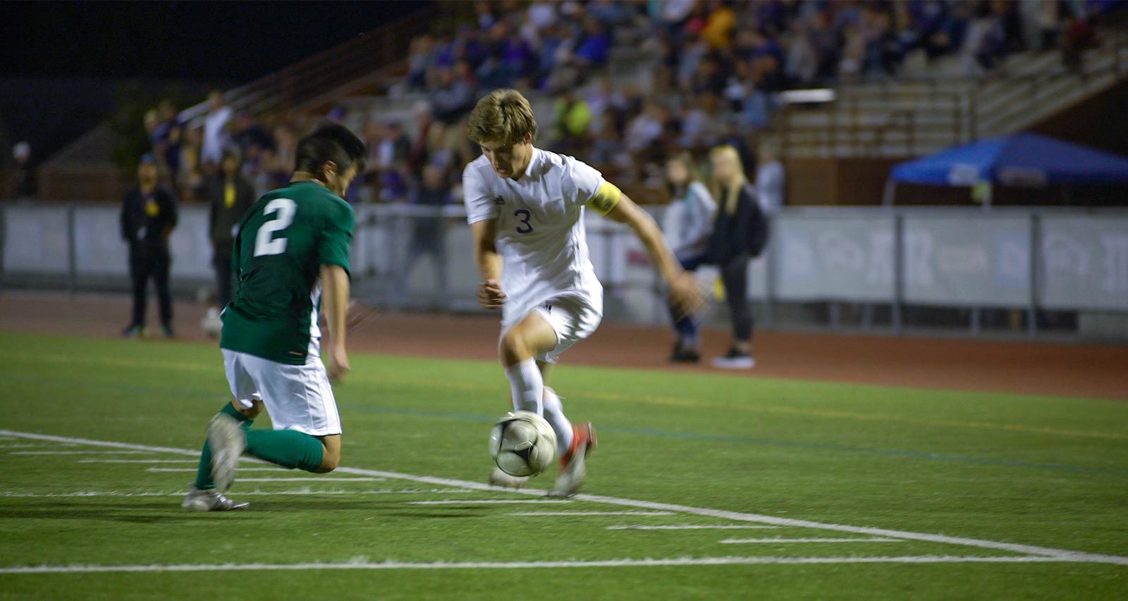 The Sumner captain takes on a Skyline defender at the 2018 Washington State Soccer Championship semifinal